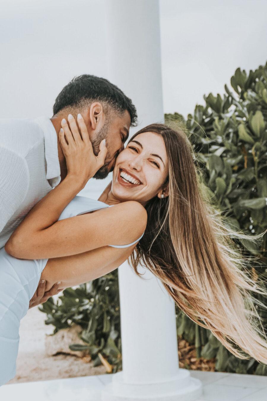 Fiancée smiling after surprise beach engagement – Riviera Maya proposal photography