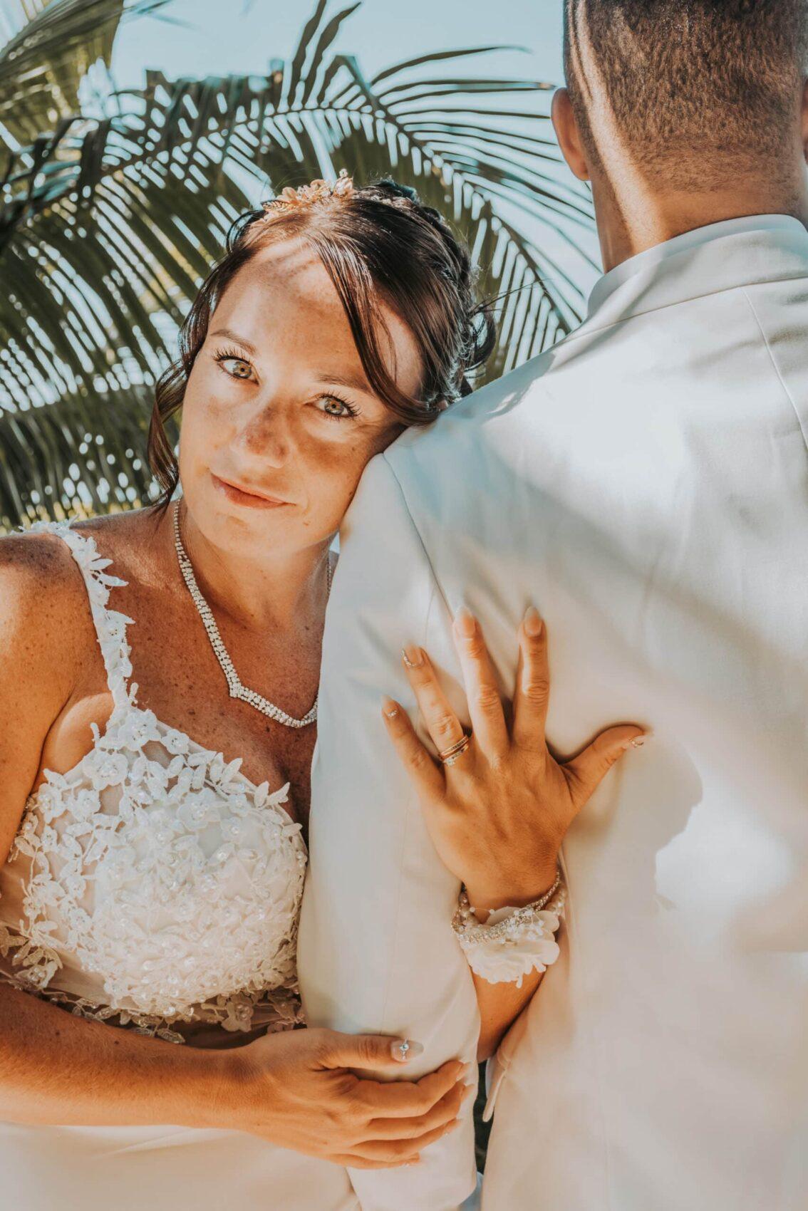 Bride and groom posing during a Caribbean beach wedding – a romantic wedding portrait photo perfect for wedding photos framed.