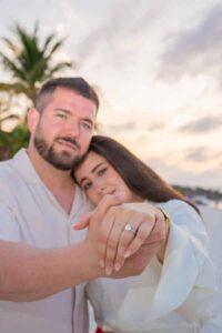 Sunset engagement proposal on the beach in Tulum, with couple surrounded by golden light