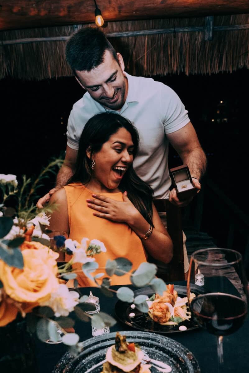 Fiancé surprising his partner during night proposal – candid reaction