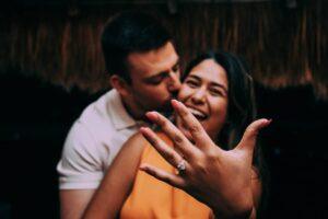 Engaged couple smiling and showing ring – post-proposal joy in Mexico