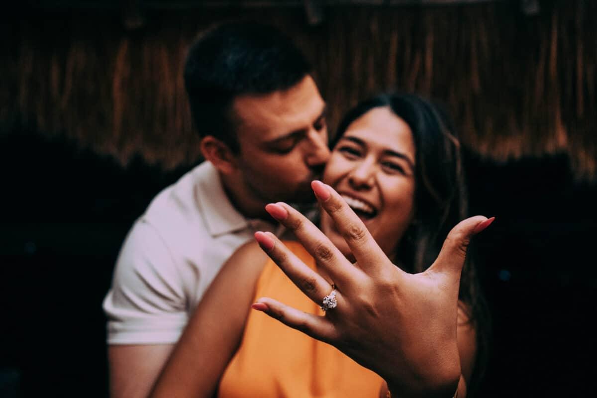 Engaged couple smiling and showing ring – post-proposal joy in Mexico