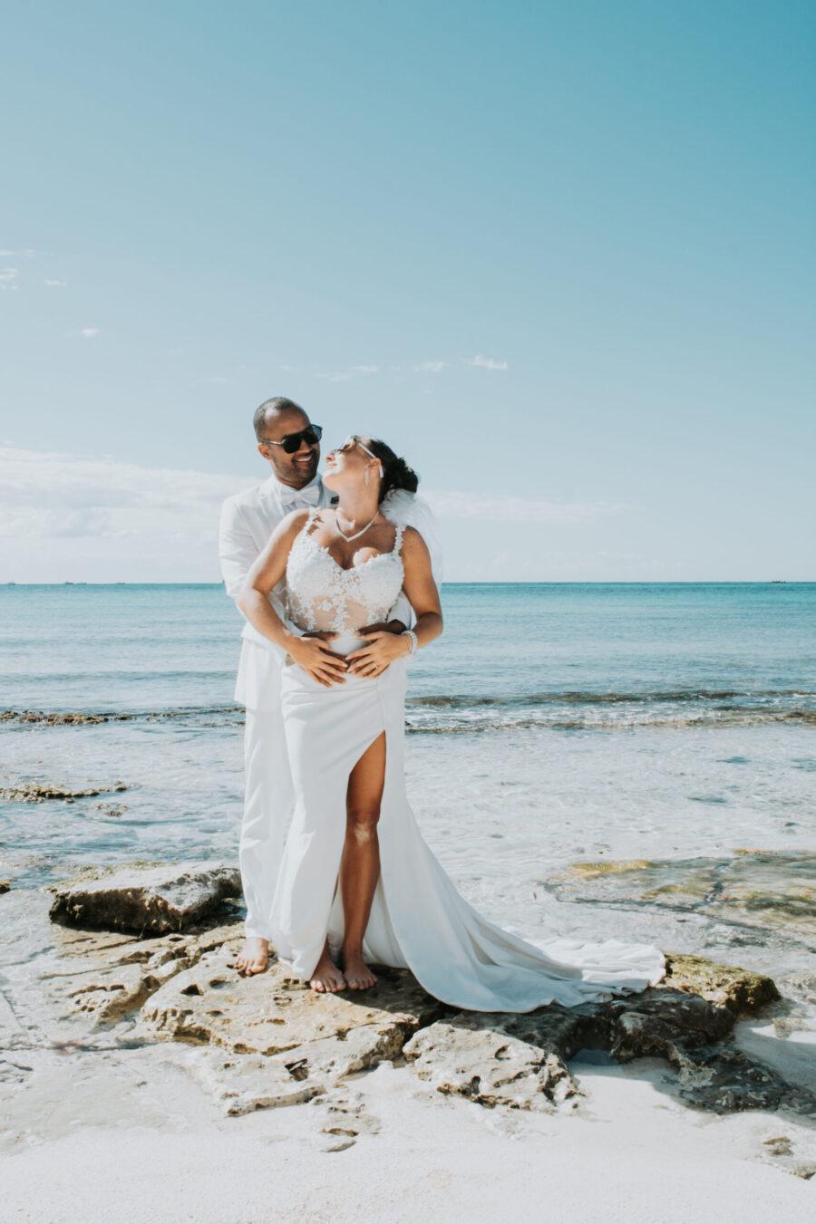 Post-wedding Trash the Dress session of Amelie and Sebastian walking into the waves at Playa del Carmen