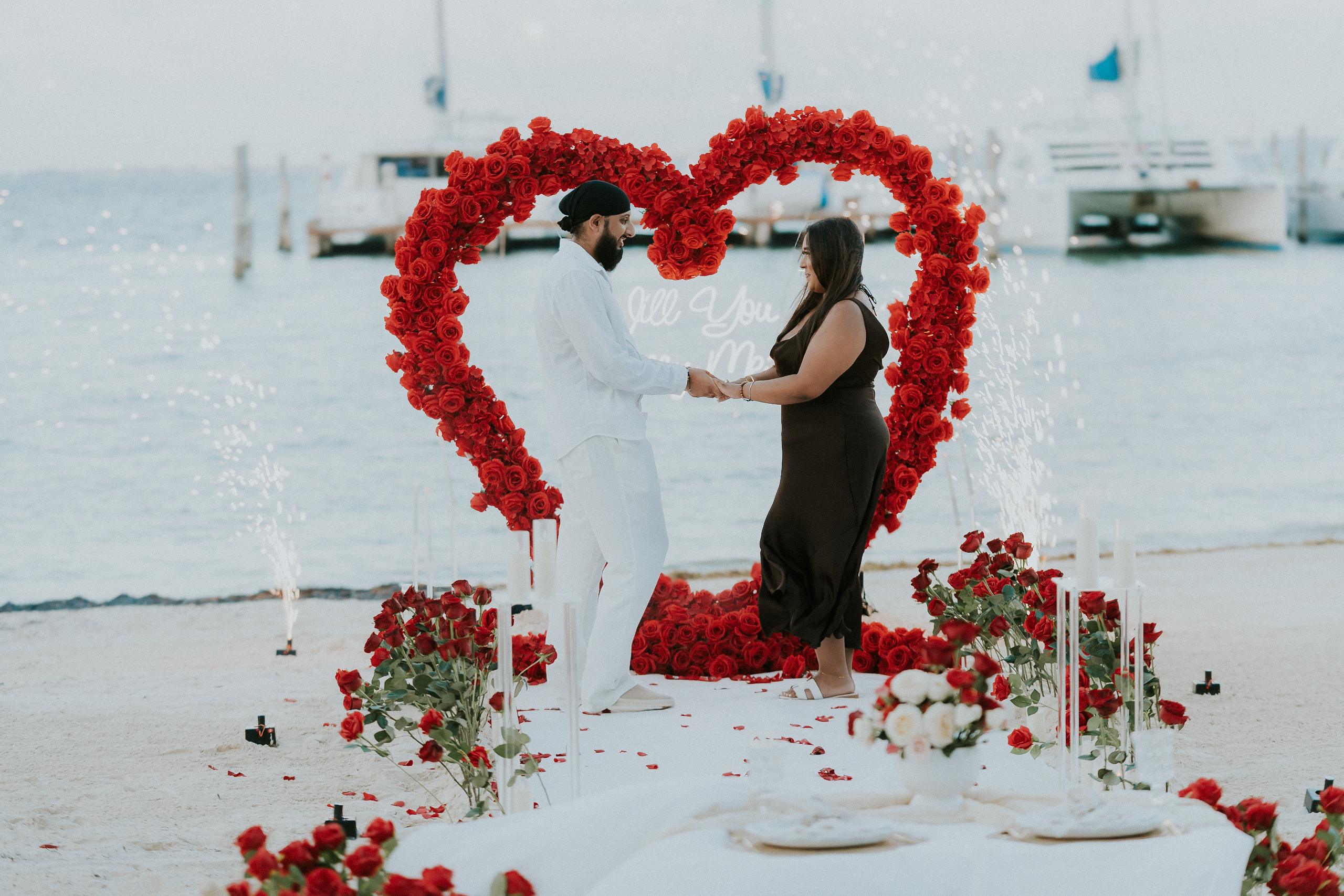 Marriage proposal in Playa del Carmen with romantic beachside dinner and sunset decor