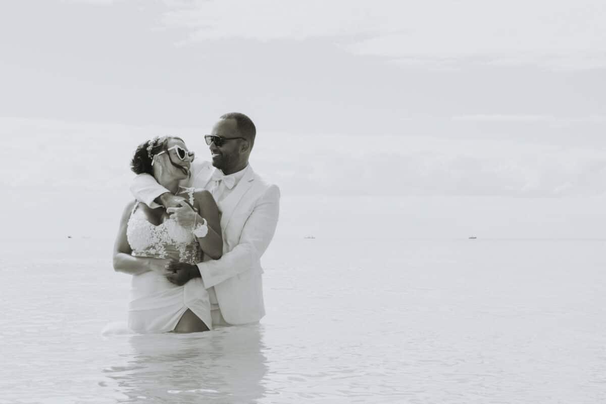 Bride and groom embracing in the sea – Trash the Dress shoot in Playa del Carmen